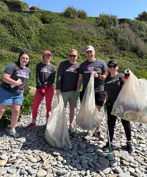 Group of people picking up trash