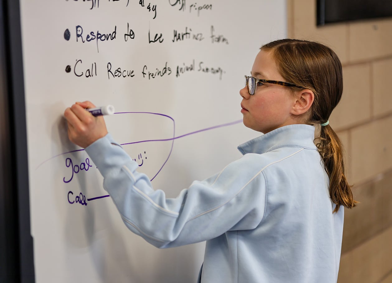 Girl at whiteboard